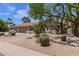 Charming home with a desert landscaped front yard and a spacious three-car garage at 4532 E Sandra Ter, Phoenix, AZ 85032