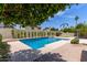 Private backyard pool featuring well-maintained landscaping and privacy fencing at 4532 E Sandra Ter, Phoenix, AZ 85032