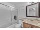 An updated bathroom with a shower, toilet, and vanity with a marble countertop at 461 W Holmes Ave # 180, Mesa, AZ 85210
