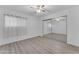 Bright bedroom with hard surface floors, a fan, closet and soft window lighting at 461 W Holmes Ave # 180, Mesa, AZ 85210