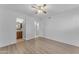 Clean bedroom featuring hard surface floors and a view to the attached bathroom at 461 W Holmes Ave # 180, Mesa, AZ 85210