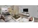 Bright living room featuring modern furnishings, decor, and a TV with a media console at 461 W Holmes Ave # 180, Mesa, AZ 85210