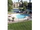Relaxing community pool and tennis courts with lush green lawns provide a great outdoor space at 461 W Holmes Ave # 180, Mesa, AZ 85210