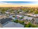An aerial view of homes in a vibrant community with mountain views on the horizon at 4610 N 14Th Ave, Phoenix, AZ 85013
