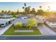 Aerial view of a lovely home with a well-kept lawn, mature trees, and convenient covered parking at 4610 N 14Th Ave, Phoenix, AZ 85013