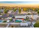Stunning aerial view of a charming neighborhood with a sparkling pool and mountain views in the background at 4610 N 14Th Ave, Phoenix, AZ 85013