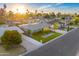 Bright aerial shot of a well-manicured property with lush lawn, mature trees, and neighborhood views at 4610 N 14Th Ave, Phoenix, AZ 85013