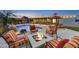 Inviting backyard featuring a pool, fire pit, outdoor seating, and covered patio area for entertainment at 4610 N 14Th Ave, Phoenix, AZ 85013