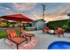 Relaxing backyard with lounge chairs, hot tub, firepit, and vibrant flower mural for outdoor enjoyment at 4610 N 14Th Ave, Phoenix, AZ 85013