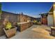 Charming backyard featuring a built in BBQ with decorative stone and a concrete patio at 4610 N 14Th Ave, Phoenix, AZ 85013