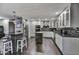 Modern kitchen with stainless steel appliances, white cabinets, granite countertops, and stylish backsplash at 4610 N 14Th Ave, Phoenix, AZ 85013