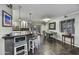 Stylish kitchen and dining area featuring modern bar seating, sleek countertops, and ample natural light at 4610 N 14Th Ave, Phoenix, AZ 85013