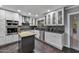Modern kitchen featuring white cabinetry, stainless steel appliances, backsplash, and granite countertops at 4610 N 14Th Ave, Phoenix, AZ 85013