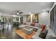 Spacious living room with a comfortable sectional sofa, ceiling fan, and access to outdoor patio at 4610 N 14Th Ave, Phoenix, AZ 85013
