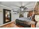 Stylish bedroom with wood accents, ceiling fan, and barn door leading to the bathroom at 4610 N 14Th Ave, Phoenix, AZ 85013