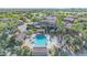 Aerial view of the neighborhood with a community pool, clubhouse, and green space at 4700 S Fulton Ranch Blvd # 11, Chandler, AZ 85248