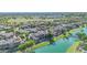 Beautiful aerial view of a neighborhood with lush landscaping and a serene lake at 4700 S Fulton Ranch Blvd # 11, Chandler, AZ 85248