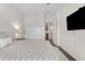 Bedroom featuring a comfortable bed, dark wood floors, and a TV at 4700 S Fulton Ranch Blvd # 11, Chandler, AZ 85248