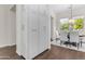 Dining area with a wooden table and chairs, complemented by a bright window and ample cabinet space at 4700 S Fulton Ranch Blvd # 11, Chandler, AZ 85248