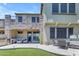Spacious backyard featuring a stone patio with an outdoor kitchen, dining area, and lush landscaping at 4700 S Fulton Ranch Blvd # 11, Chandler, AZ 85248
