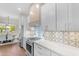 Modern kitchen featuring white cabinets, stainless steel appliances, and a stylish tile backsplash at 4700 S Fulton Ranch Blvd # 11, Chandler, AZ 85248