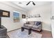 Cozy living room featuring a window, a sofa with pillows, and a rug at 4700 S Fulton Ranch Blvd # 11, Chandler, AZ 85248