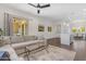 Bright living room with a comfortable sofa, glass coffee table, and open access to the kitchen area at 4700 S Fulton Ranch Blvd # 11, Chandler, AZ 85248