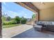 Outdoor kitchen and patio area with a built-in grill, seating, and beautiful landscaping at 4700 S Fulton Ranch Blvd # 11, Chandler, AZ 85248