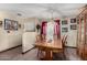 Classic dining room with a chandelier, wood furniture, and neutral walls at 4957 W Onyx Ave, Glendale, AZ 85302