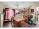 Cozy dining room with classic furniture and natural lighting with tile flooring at 4957 W Onyx Ave, Glendale, AZ 85302