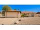 Charming single-story home with a two-car garage and low-maintenance desert landscaping at 4957 W Onyx Ave, Glendale, AZ 85302
