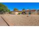 Single-story home featuring an attached two-car garage and desert landscaping at 4957 W Onyx Ave, Glendale, AZ 85302