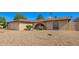 Charming single-story home with desert landscaping, complemented by a two-car garage at 4957 W Onyx Ave, Glendale, AZ 85302