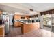This kitchen features tile floors, wood cabinets and a sliding glass door to the backyard at 4957 W Onyx Ave, Glendale, AZ 85302