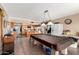 The kitchen features tile floors, wood cabinets, an island with seating, and white appliances at 4957 W Onyx Ave, Glendale, AZ 85302