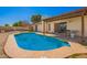 Sparkling pool surrounded by concrete decking, enhanced by a covered patio and backyard scenery at 4957 W Onyx Ave, Glendale, AZ 85302
