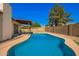 Backyard pool with desert landscaping providing a refreshing retreat and outdoor relaxation at 4957 W Onyx Ave, Glendale, AZ 85302