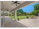 Spacious covered patio overlooking the well-manicured backyard and landscaping at 6102 E Danbury Rd, Scottsdale, AZ 85254