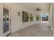 Back patio featuring a ceiling fan and entry to the home at 6102 E Danbury Rd, Scottsdale, AZ 85254