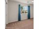 Bedroom featuring a ceiling fan, window, and blue curtains at 6102 E Danbury Rd, Scottsdale, AZ 85254