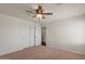 Bedroom featuring a ceiling fan and closet with sliding doors at 6102 E Danbury Rd, Scottsdale, AZ 85254