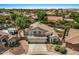 Two-story home featuring a three-car garage, well-maintained landscaping, and a backyard pool at 6102 E Danbury Rd, Scottsdale, AZ 85254