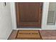 Close-up view of a dark wood front door with a 