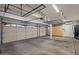 Spacious garage with multiple car spaces and ample storage shelving at 6102 E Danbury Rd, Scottsdale, AZ 85254