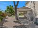 Exterior view of a garage with built in storage and access to the backyard at 6102 E Danbury Rd, Scottsdale, AZ 85254