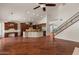 Modern kitchen featuring custom cabinetry, granite countertops, stainless steel appliances, and center island at 6102 E Danbury Rd, Scottsdale, AZ 85254