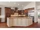 Gourmet kitchen showcasing custom cabinetry, granite countertops, and stainless steel appliances at 6102 E Danbury Rd, Scottsdale, AZ 85254