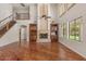Bright living room showcases hardwood floors, fireplace, built-in cabinets, and large windows at 6102 E Danbury Rd, Scottsdale, AZ 85254
