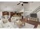 Open-concept living space showcases hardwood floors, vaulted ceilings, and seamlessly connects to the kitchen at 6102 E Danbury Rd, Scottsdale, AZ 85254