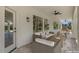 Inviting covered patio with comfortable wicker seating and stylish accents, perfect for outdoor relaxation at 6102 E Danbury Rd, Scottsdale, AZ 85254